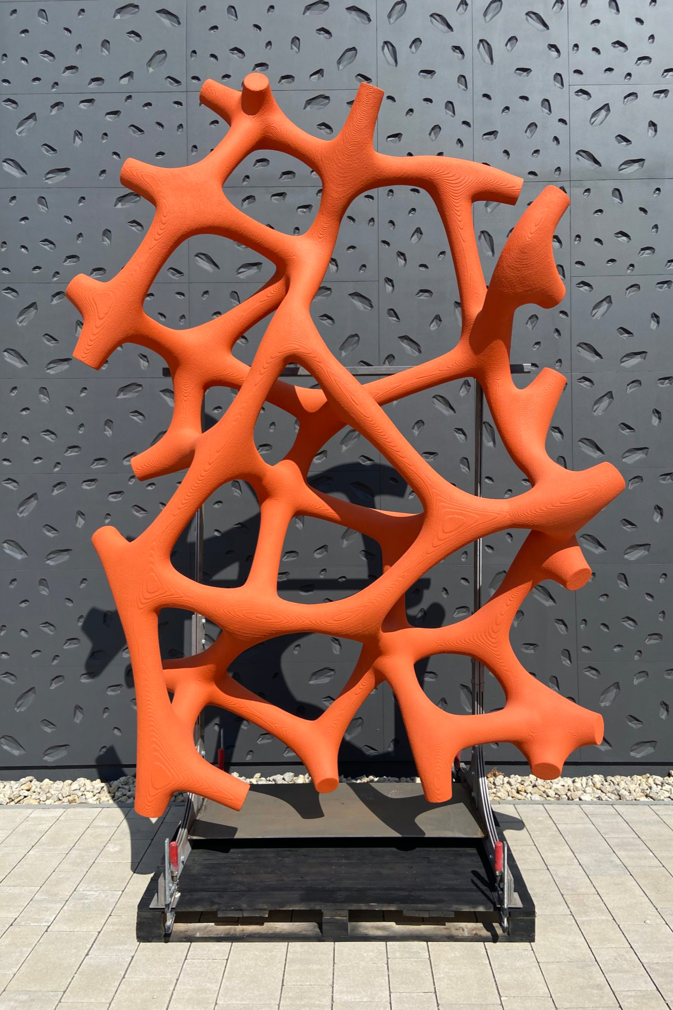 orange painted piece for 3d printed facade