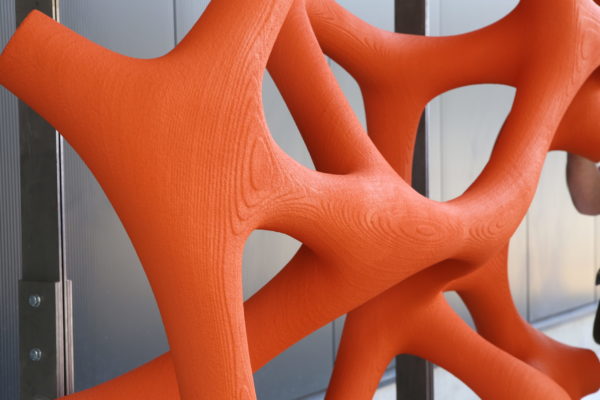 detail of orange painted piece for 3d printed facade
