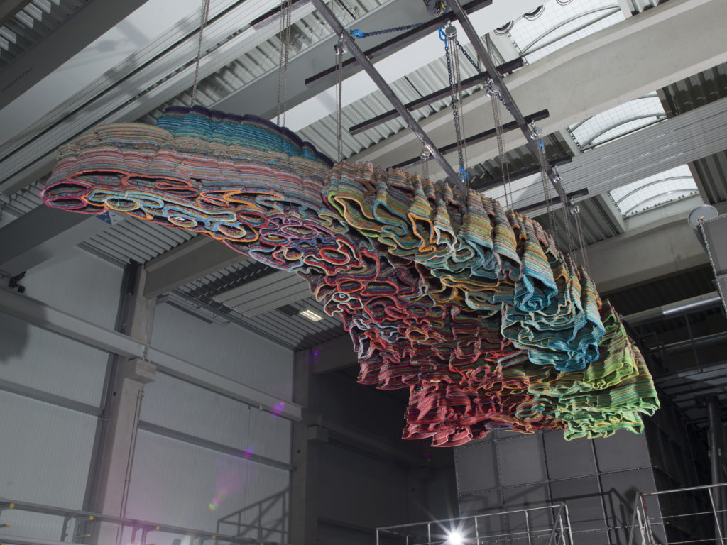 finished 3d printed artwork hanging of roof in factory
