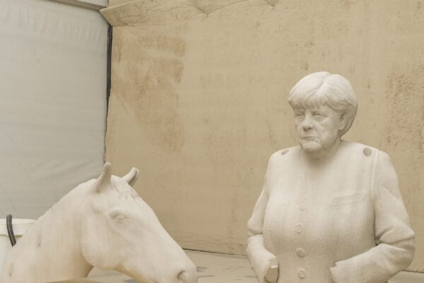 parts of 3d printed equestrian angela merkel during fabrication process