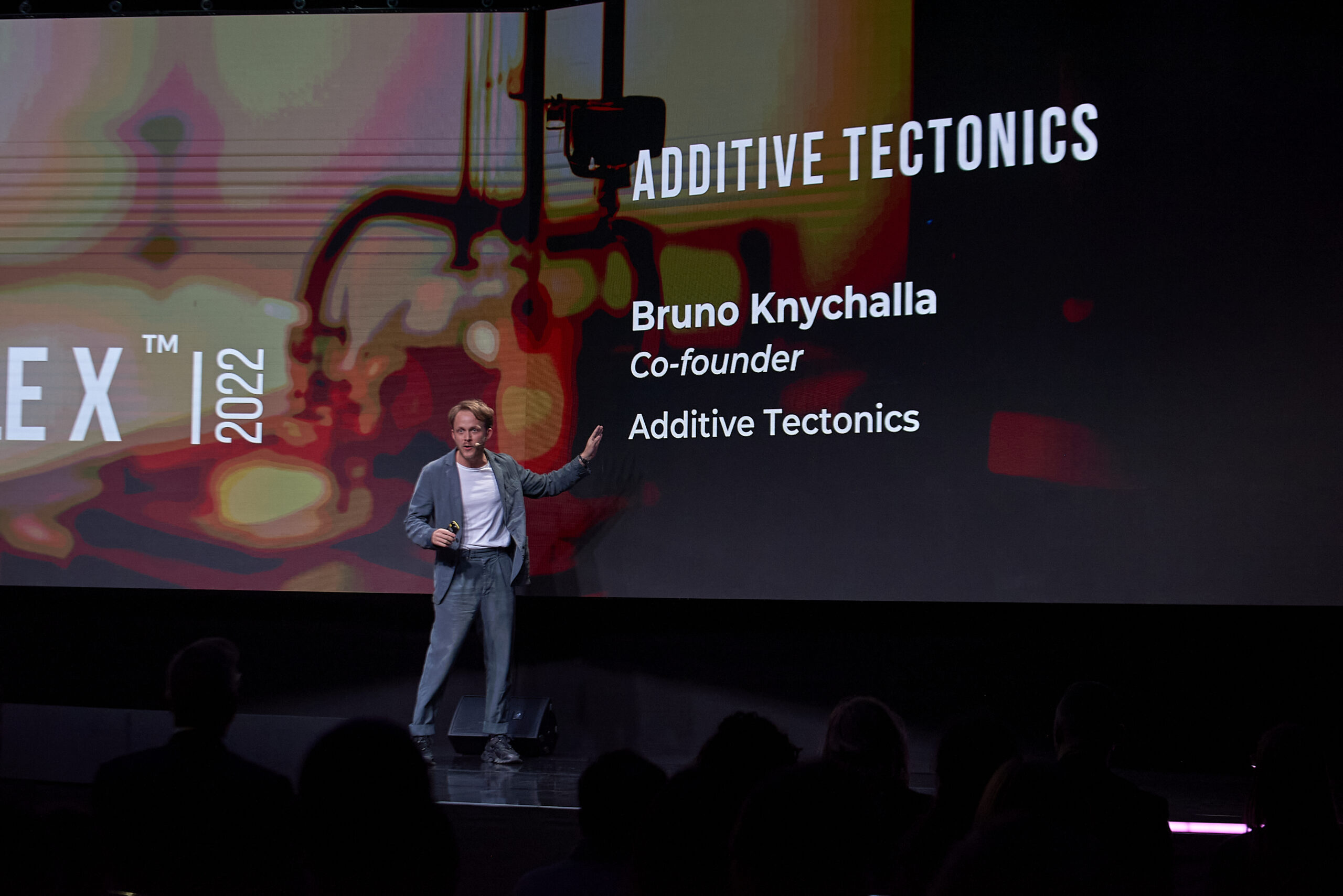 In front of a crowd, Bruno Knychalla presents additive tectonics at Puzzle X Conference 2022 in Barcelona
